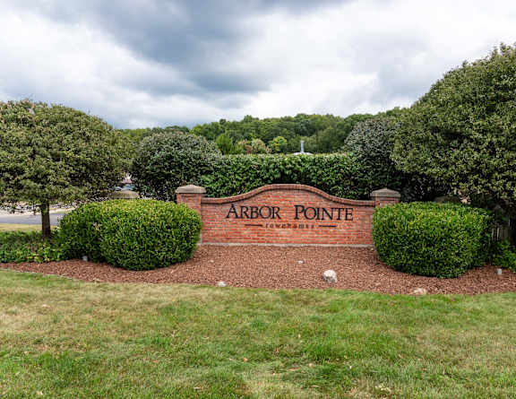 the sign at the entrance to bath farms with flowers