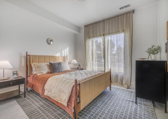 a bedroom with a bed and a closet