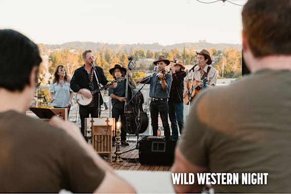 A group of people are playing music on a stage with the words "Wild Western Night" written on the image.