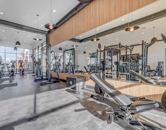 a gym with weights machines and other exercise equipment