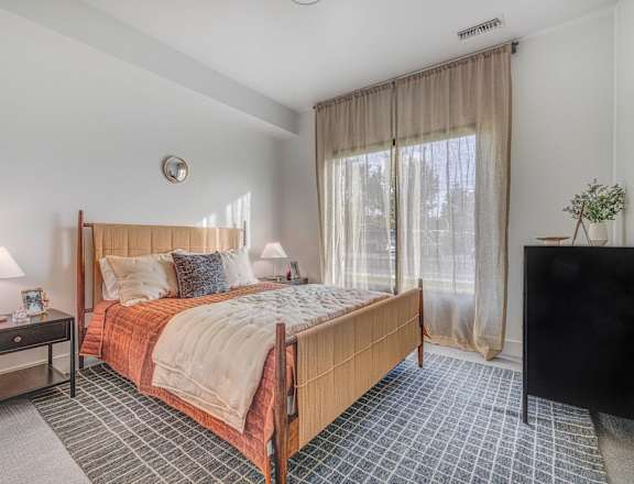 Upscale bedroom at The Opal pet-friendly apartments in West Valley, Utah
