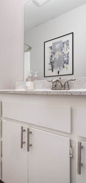 a bathroom with a toilet sink and shower