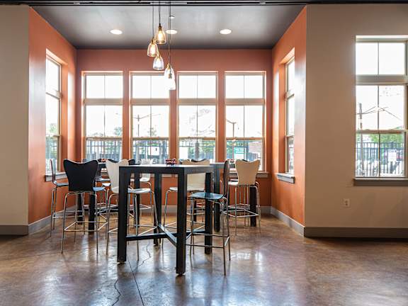 A room with a table and chairs in it  at Bristol Station Apartments, Carteret, New Jersey