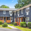 the front  of an apartment building with a sidewalk in front of it at Gardens at Washington Park in Atlanta, Georgia 30314