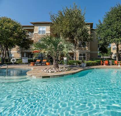 Swimming pool at Woodbridge Villas Apartments, Sachse, TX