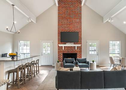 A living room with a fireplace and a couch.