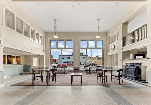 A large open kitchen and dining room with a fireplace and a view of the outdoors at 206 Flats, Spokane, WA
