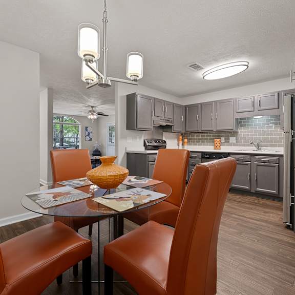 Open-concept kitchen and dining room with wood-style flooring
