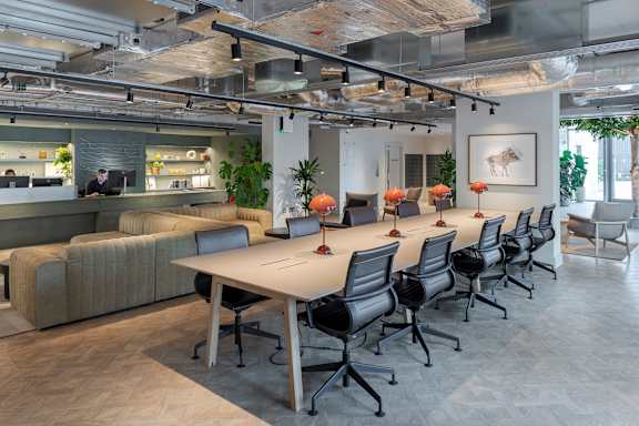 a conference room with a long table and chairs