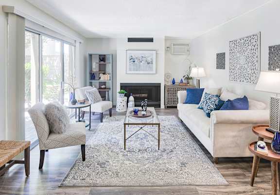 A living room with a fireplace and a couch.