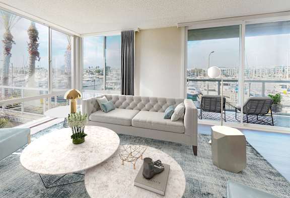 A modern living room with a large window overlooking a marina.