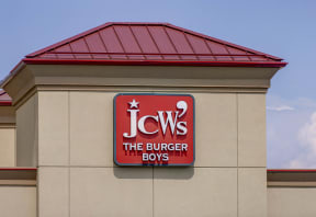 the sign the burger boys on the side of a building