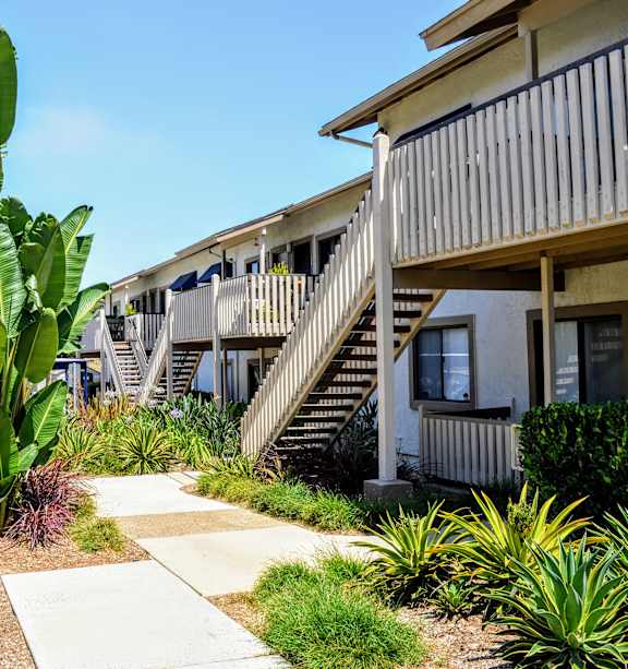 A row of houses with a pathway in the middle.at La Jolla Canyon Apartments, San Diego, CA