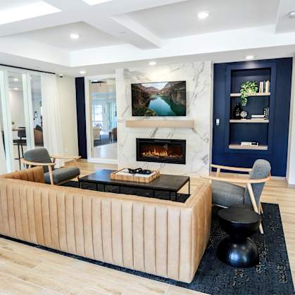 a living room with a couch and a fireplace