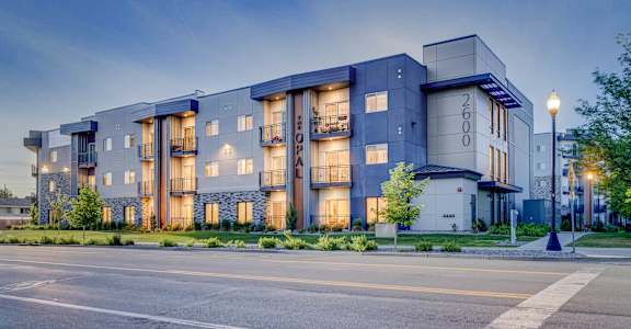 A modern apartment building with the number 2600 on the front.