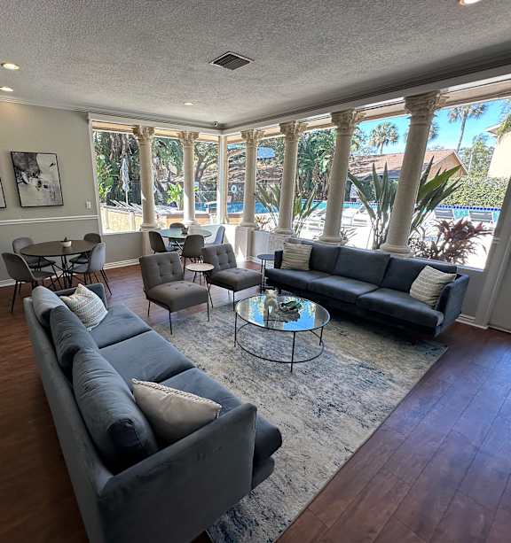 A living room with a long couch and a table.