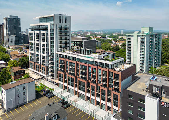a rendering of an apartment building on a city street