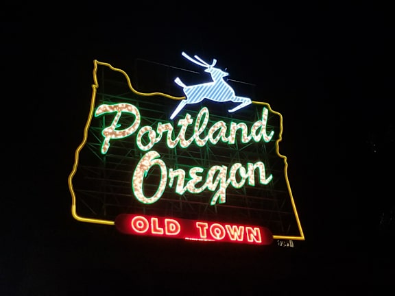A neon sign for Portland Oregon Old Town.