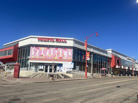 The exterior of the Pacific Mall building is shown on a clear day.