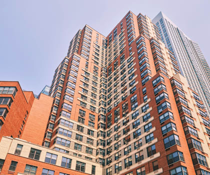 a tall building with a blue sky in the background