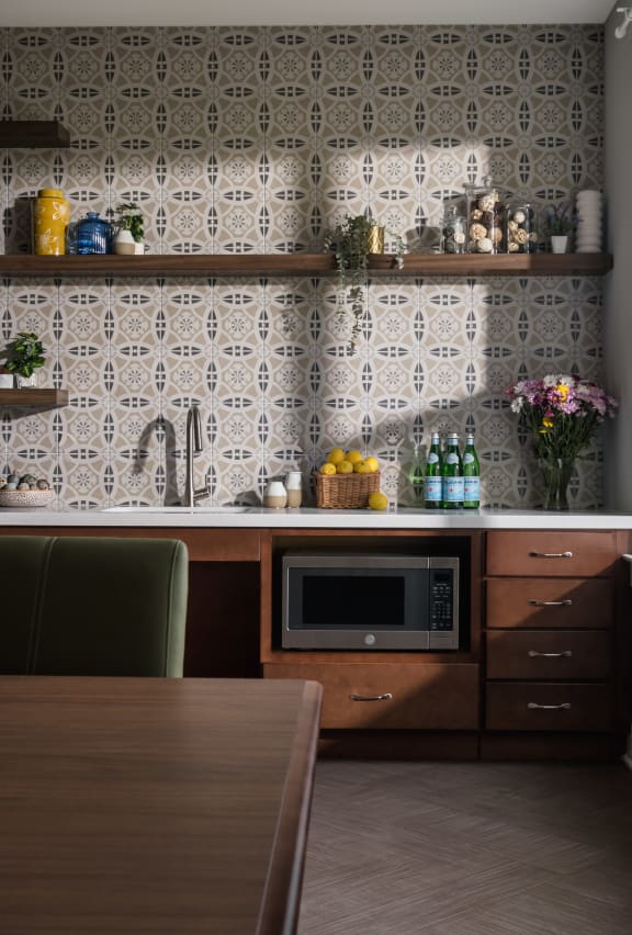 a small kitchen with a microwave and a table