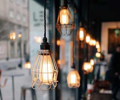 a row of hanging lights in a restaurant