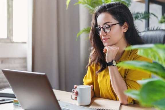Person at Desk in Front of a Laptop at Yacht Club
