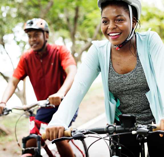 a woman and a man riding bikes at Canyon Creek, Texas, 78759
