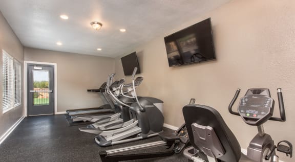 the gym has plenty of cardio equipment at our apartments at Lodge of Overland Park Apartments, Overland Park , 66212