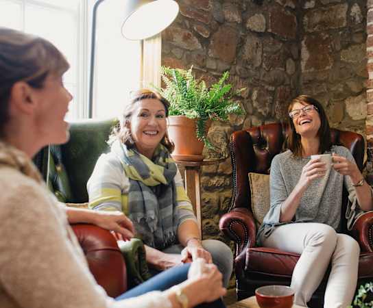 a group of women sitting in a living room at Preserve West, Madison, Wisconsin