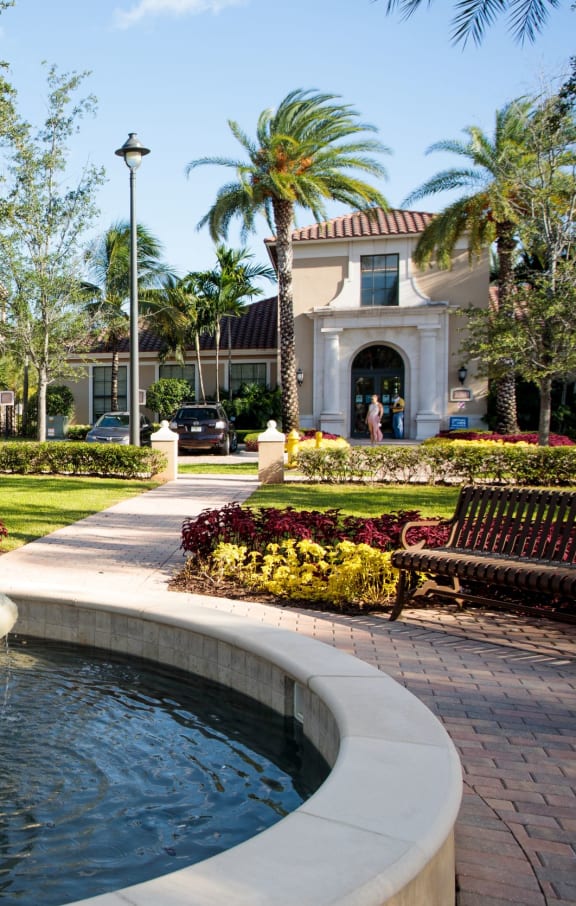 a fountain in a park in front of a building at The Atlantic Doral, Florida, 33178