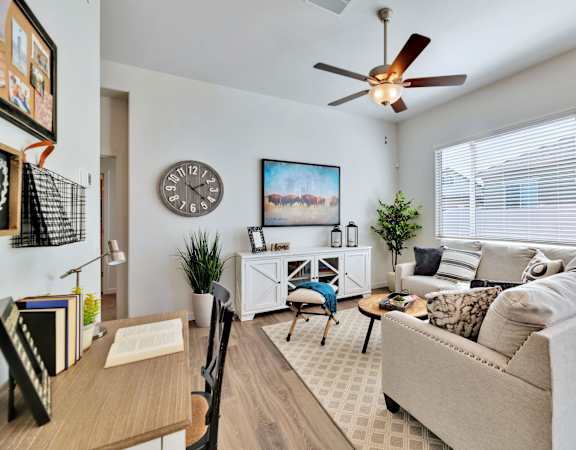 a living room with a couch and a ceiling fan at Parke Place, Prescott Valley, Arizona