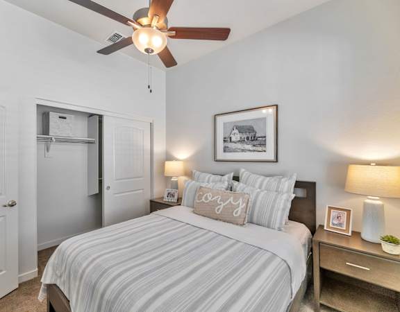 a bedroom with a large bed and a ceiling fan at Parke Place, Prescott Valley, Arizona