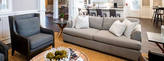 Sofa and Kitchen in Clubhouse at Legacy Farm located in Collierville, TN 38017