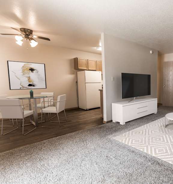 Bismarck, ND Stonefield Townhomes | a living room with a couch and a table and a tv