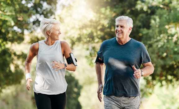 an older couple walking in the park