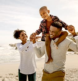 a group of people playing with bubbles on the beach