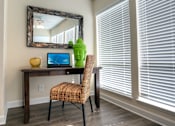 Thumbnail 8 of 24 - A cozy nook in the sunroom is at the ready for work from home.