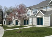 Thumbnail 2 of 4 - a row of homes in a subdivision