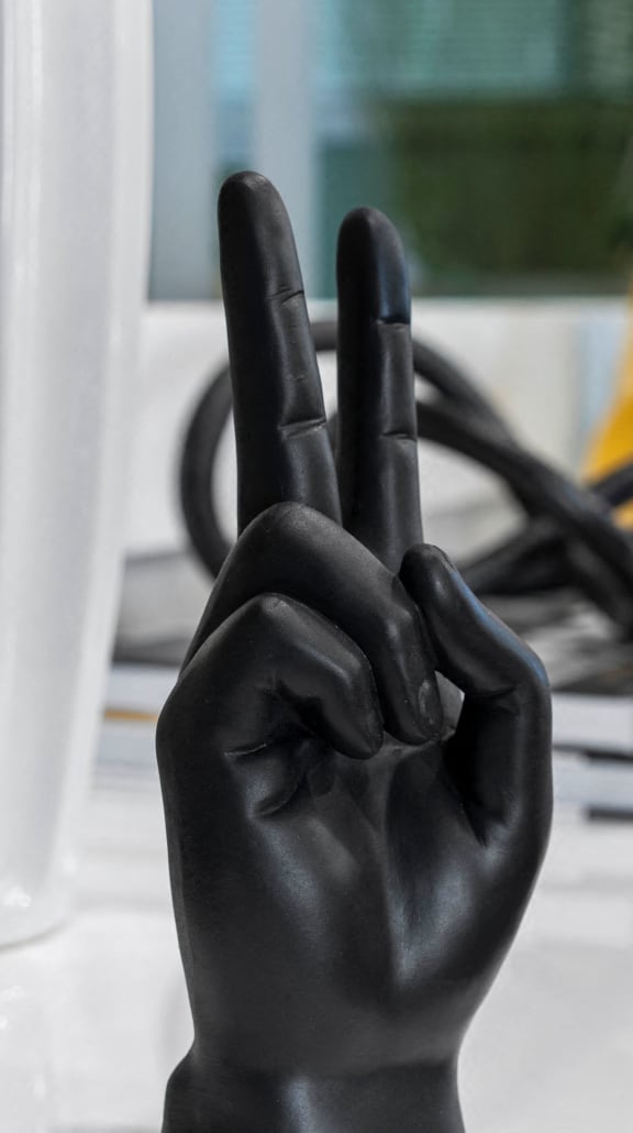 a pair of black hands on top of a kitchen counter