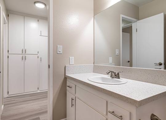 an empty bathroom with a sink and a mirror at Colima Terrace Apts, Rowland Heights California
