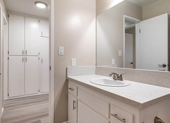 an empty bathroom with a sink and a mirror at Colima Terrace Apts, Rowland Heights California