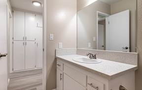 an empty bathroom with a sink and a mirror at Colima Terrace Apts, Rowland Heights California