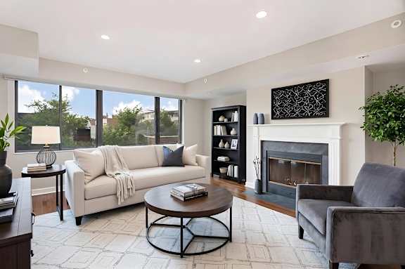 A living room with a fireplace and a couch.