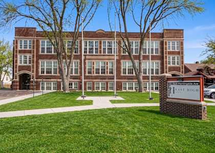 A brick building with a sign that says East High.