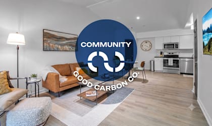 A living room with a large blue circle in the middle that says Community Good Carbon Co.