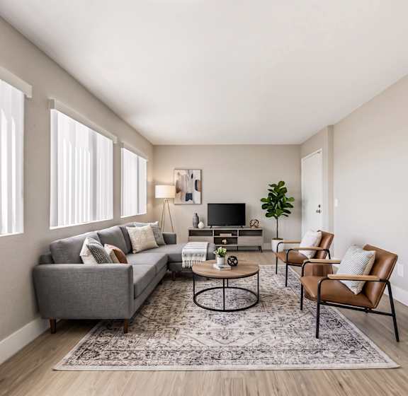 A room with a desk, chair, and book. at Chamoune Senior Apartments, San Diego, 92115