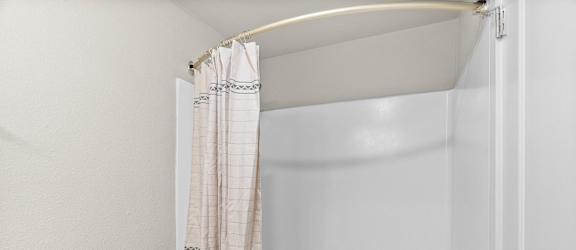White Bathroom with tub at Timbre Apartments, Washington