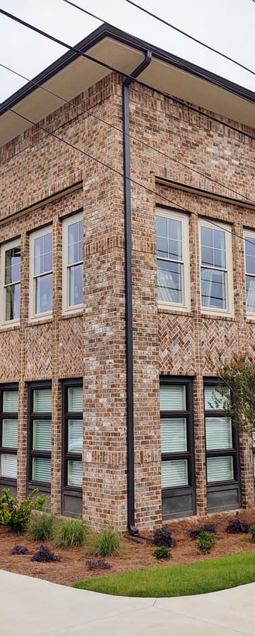 a building with a sidewalk in front of it