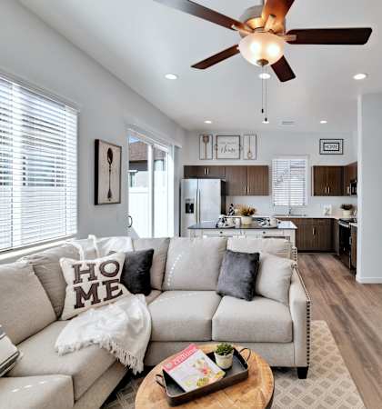 a living room with a couch and a ceiling fan at Parke Place, Prescott Valley, Arizona